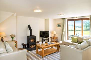 Enjoy the wonderful setting from the living-area and on chilly evenings snuggle up in front of the wood-burner.