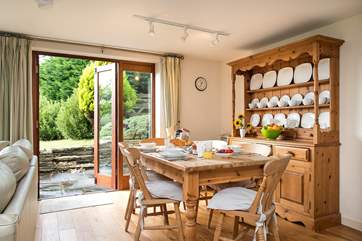 The dining-area has French doors out to the terrace.