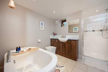 The ground floor family bathroom has a separate shower cubicle and free standing bath.