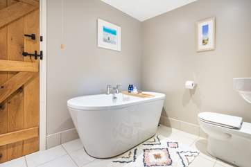 The stylish free-standing bath in the family bathroom.
