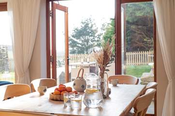 French doors lead out to the sunny terrace and garden.