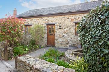 Behind the stone façade, a beautifully presented home is waiting to greet you.