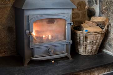 The wood-burner in the sitting-room.
