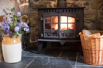 The roaring wood-burner in the dining-room.