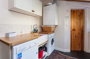 The utility room with access to a ground floor shower-room.