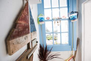 The bright hallway with original sash windows.