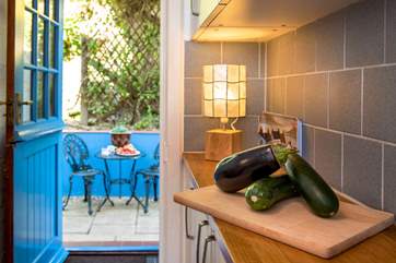 The kitchen stable-door opens to the private courtyard...