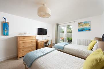 Bedroom one can be made as a super king double or a twin to your preference. It also features access to the outdoor space, and the family bathroom is just next door.