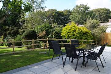 The patio is west-facing and catches the sun from mid-morning to late evening.