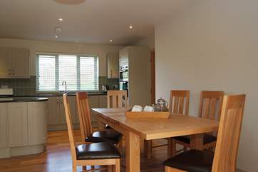 The dining-area links the kitchen and sitting-areas.