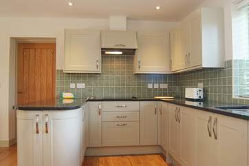 There are bespoke granite work surfaces in the kitchen.