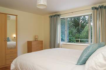 The ground floor bedroom looks out over the patio and garden.
