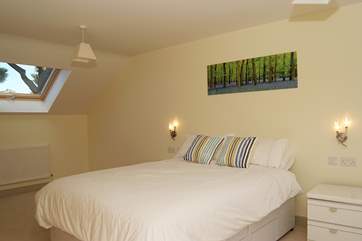 Bedroom 2 is extremely spacious, with a 5' bed, a sitting-area and an en suite shower-room.