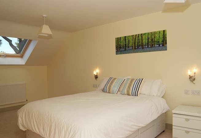 Bedroom 2 is extremely spacious, with a 5' bed, a sitting-area and an en suite shower-room.