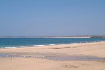 The little seaside train stops at spectacular Carbis Bay on its journey between St Ives and St Erth.
