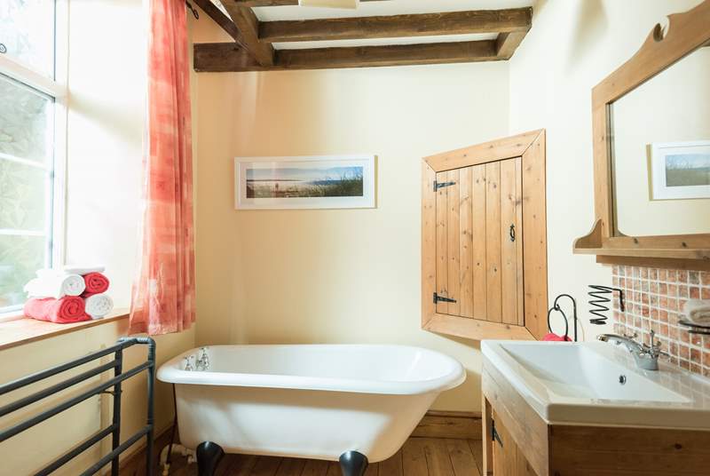 The ground floor family bathroom is complete with roll-top bath to relax and soak after a day out exploring.