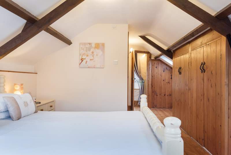 The top floor has some sloping ceilings, but the bedroom is light, airy and spacious nevertheless.