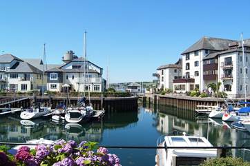 Looking across the marina to the lock gate through which boats can set out to sea (the flat roof of the building far right is the apartment's terrace).