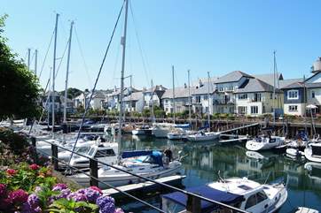 There are yachts of all sizes moored in the marina.