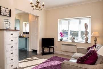 The sitting-room is flooded with natural light.