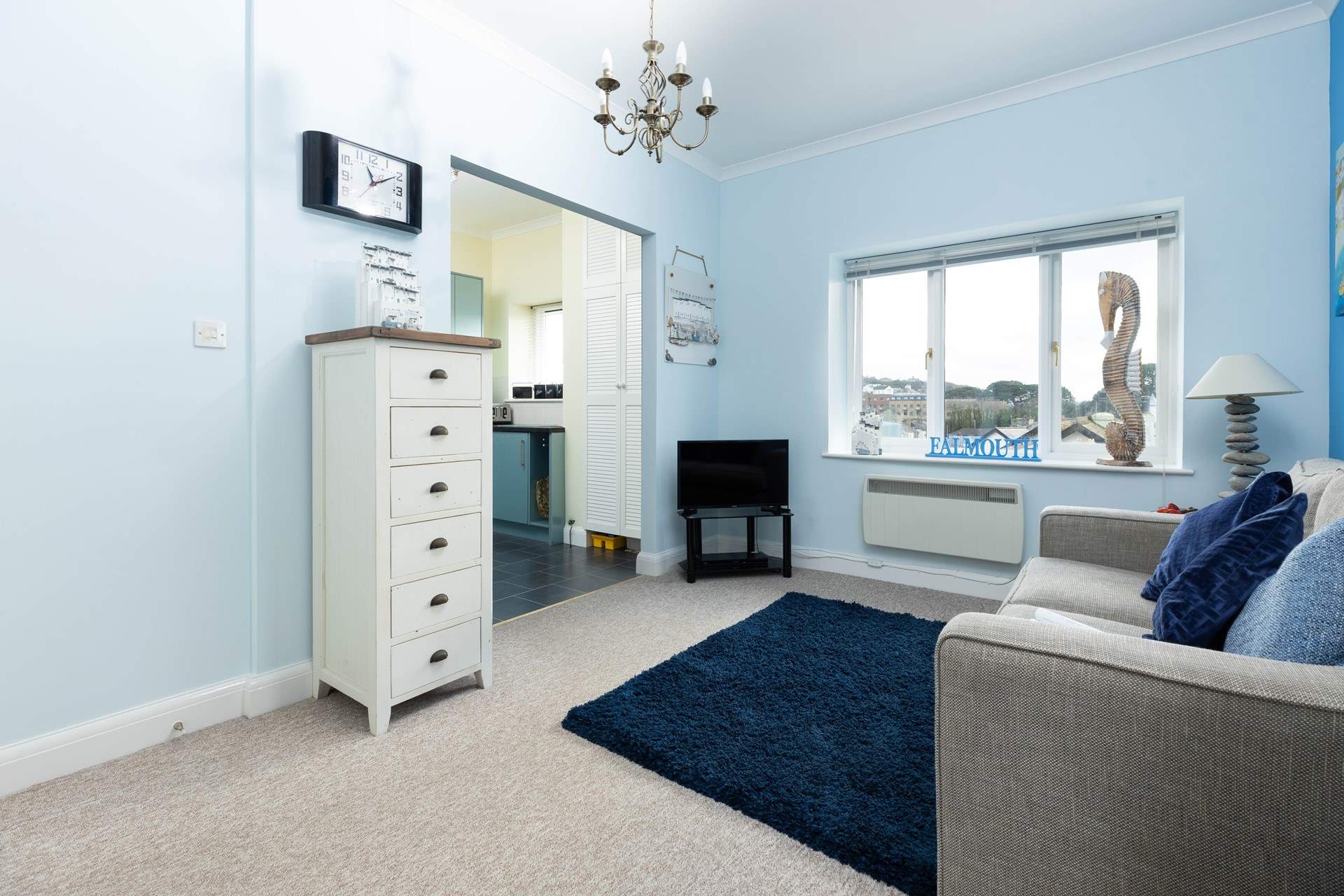 The sitting-room is flooded with natural light. 