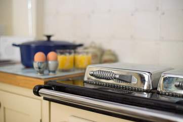 There is a Rayburn to add warmth and character to this farmhouse-style kitchen.