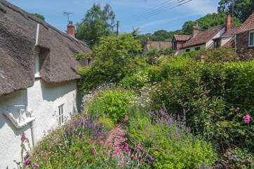 The back garden is just as beautiful and up the steps from the back of the house there is another gorgeous place to sit and relax.