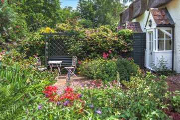 The cottage is embraced by its wonderful garden - an absolute delight of colour and variety.