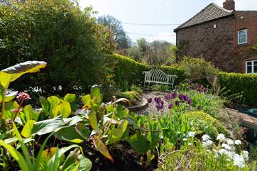 The back garden is just as beautiful and up the steps from the back of the house there is another gorgeous place to sit and relax.