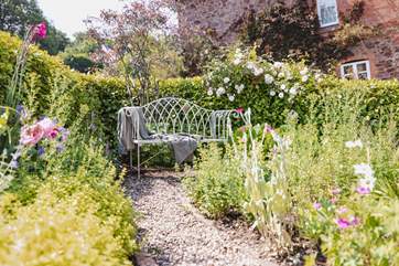 The back garden is just as beautiful and up the steps from the back of the house there is another gorgeous place to sit and relax.