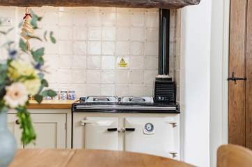 There is a Rayburn to add warmth and character to this farmhouse-style kitchen.