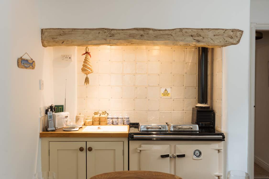 There is a Rayburn to add warmth and character to this farmhouse-style kitchen.