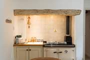 There is a Rayburn to add warmth and character to this farmhouse-style kitchen.
