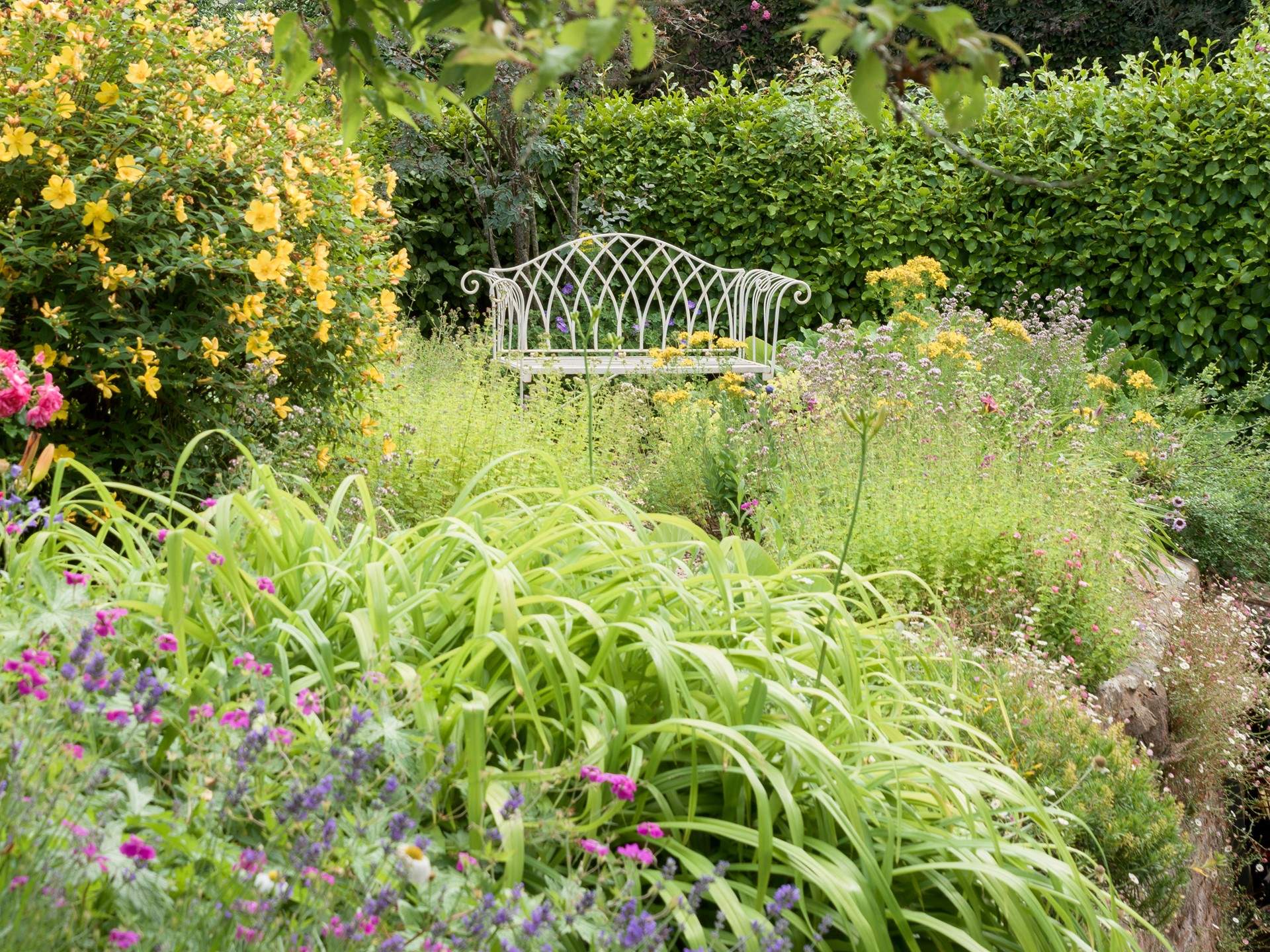 The back garden is just as beautiful and up the steps from the back of the house there is another marvellous place to sit and relax.