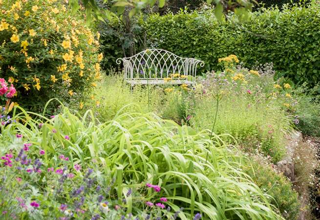 The back garden is just as beautiful and up the steps from the back of the house there is another marvellous place to sit and relax.