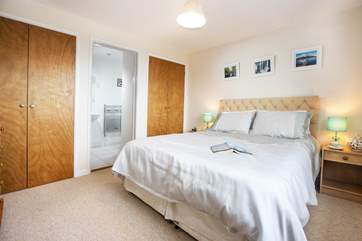Bedroom 1 also has a king-size bed and an en suite shower-room.