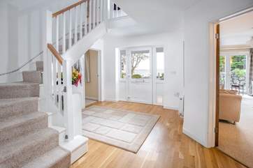 Glass doors to all the downstairs rooms enhance the sense of space and light throughout the house.