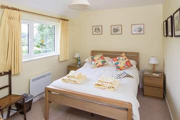The main double bedroom has views across to the village church.