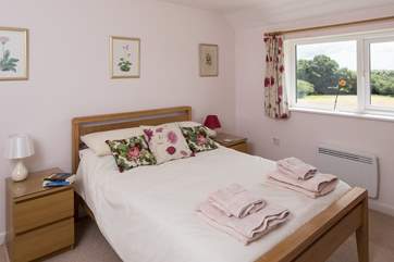 The second double bedroom is just as spacious as the first, with far-reaching rural views across the garden.