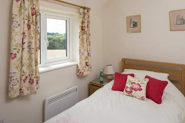 The single bedroom, bedroom 3, also looks out over open countryside.