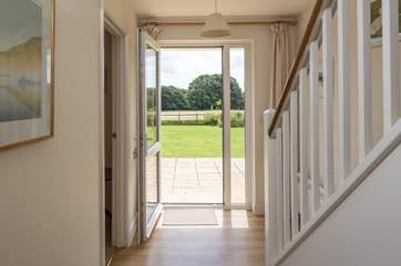 The hall is full of light and opens directly onto the south-facing patio.