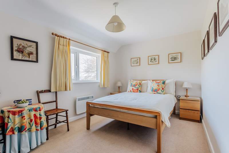 The main double bedroom has views across to the village church.
