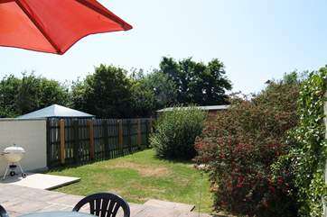 A door from the dining-area opens outside to the patio and garden.