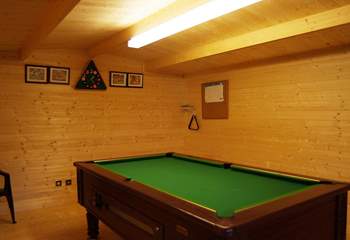 A gate at the end of the enclosed garden leads through to the games-room, where the pool table will provide hours of friendly rivalry for everyone!