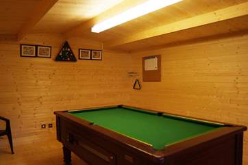 A gate at the end of the enclosed garden leads through to the games-room, where the pool table will provide hours of friendly rivalry for everyone!
