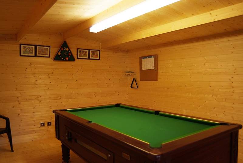 A gate at the end of the enclosed garden leads through to the games-room, where the pool table will provide hours of friendly rivalry for everyone!