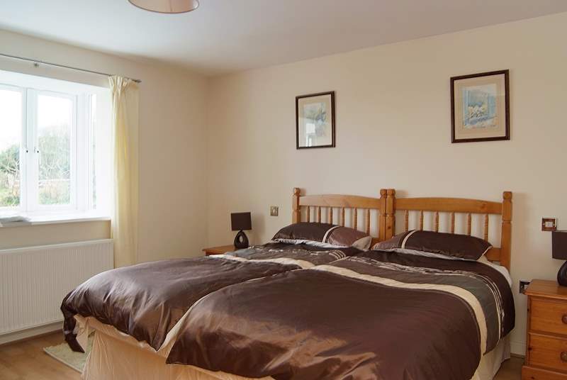 On the ground floor, bedroom 1 is furnished with versatile 'zip and link' (double or twin) beds.