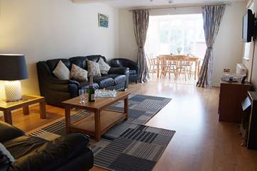 The spacious sitting-room leads straight through to the dining-area making this a very social space for friends and family.