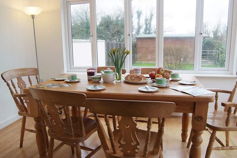 The light-filled dining-area overlooks the south-facing enclosed back garden.