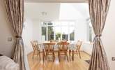 The spacious dining area overlooks the garden. - Thumbnail Image